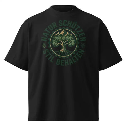 Herrenmodel in schwarzem Oversized-T-Shirt mit „Natur schützen, Stil behalten“-Motiv, 100 % Bio-Baumwolle, 200 g/m², Bio-Baumwollanteil GOTS-verifiziert.
